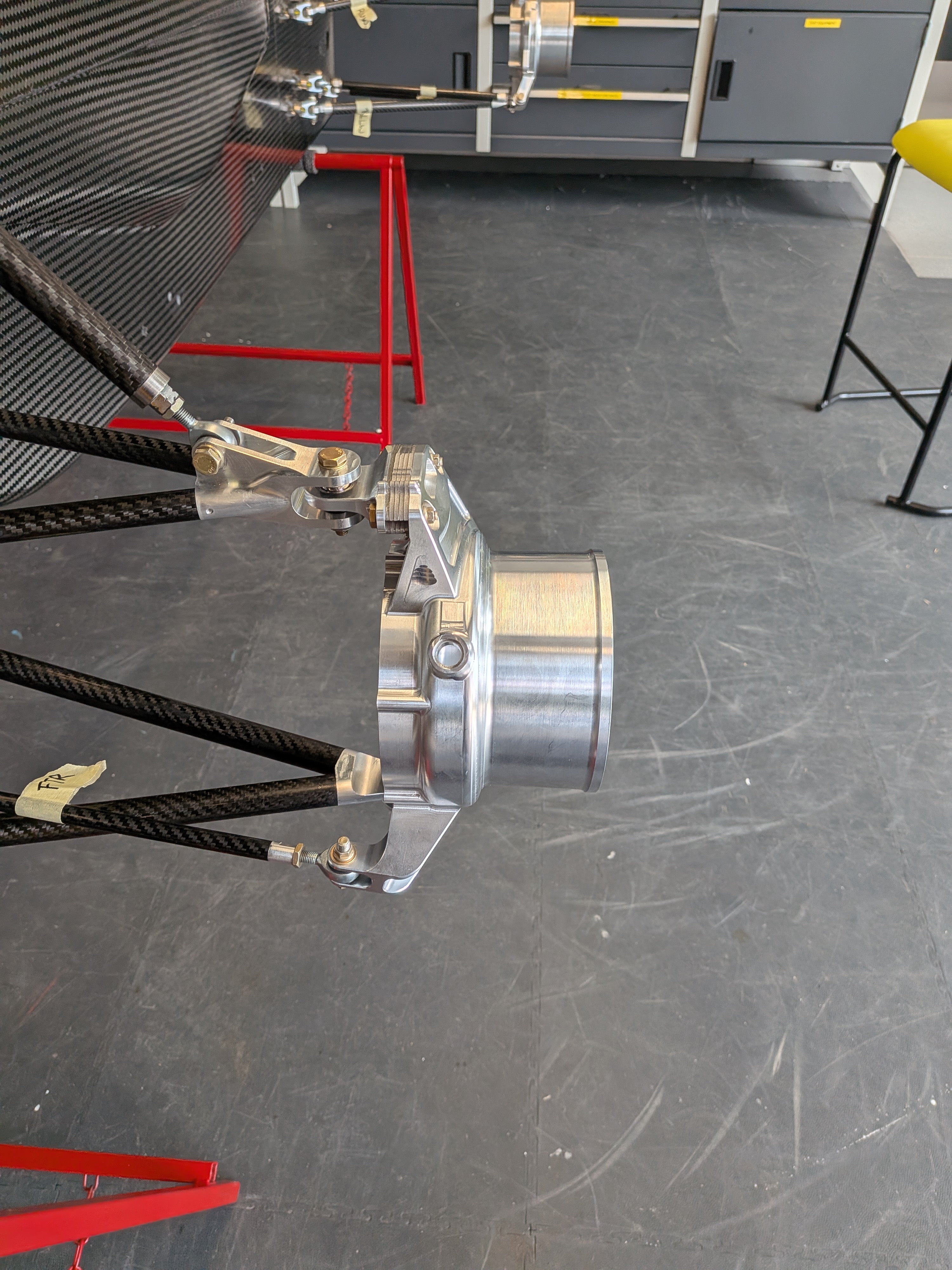 Front corner assembly with hub motor installed on carbon wishbones